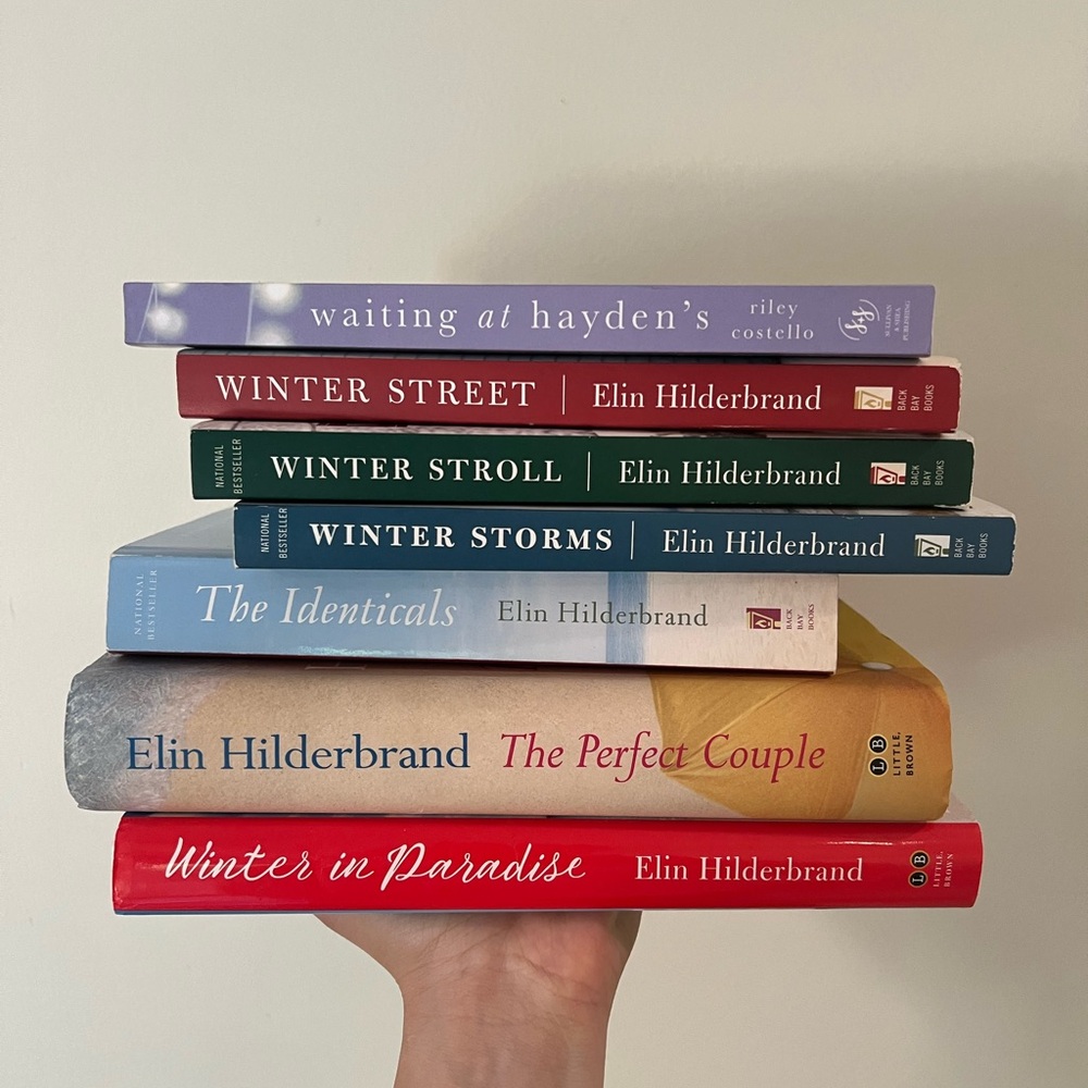 Collection of books from Elin Hilderbrand and one from Riley Costello